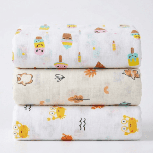 Newborn baby wrapped in premium muslin swaddle wrap